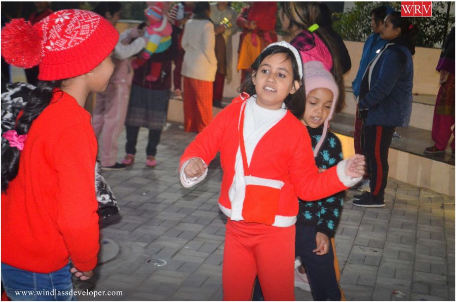 Children in Santa costumes celebrating Christmas at River Valley Township