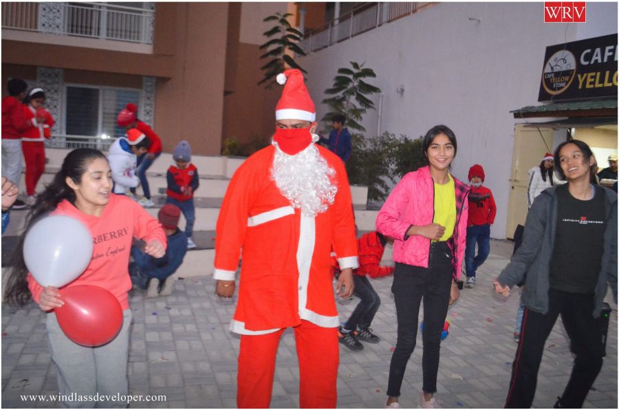 Santa Claus dancing with residents at the River Valley Christmas celebration