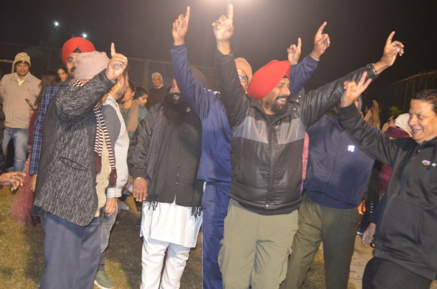 Residents dancing and celebrating together at an evening event in River Valley Township