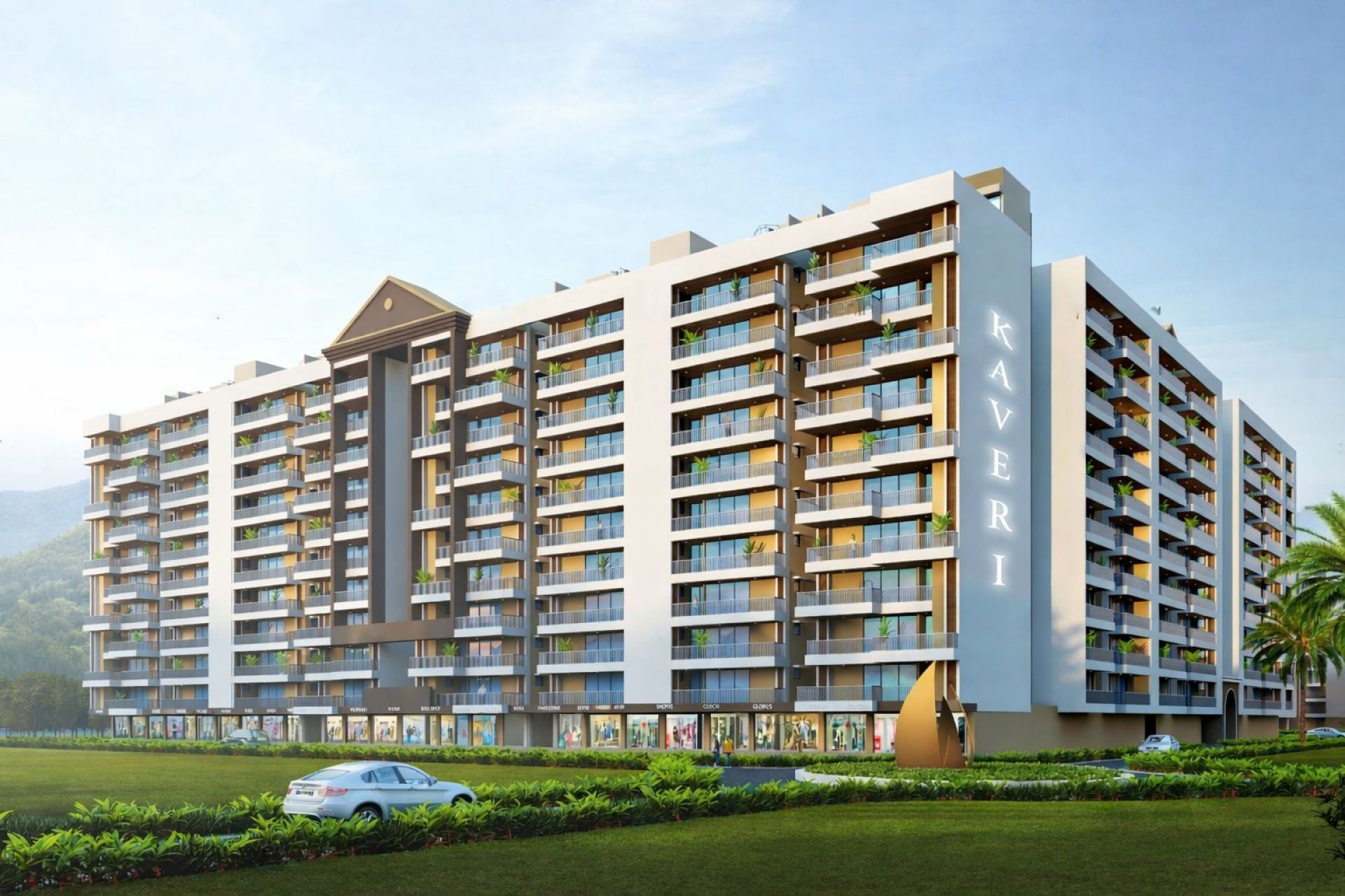 Kaveri Towers at River Valley Township, Dehradun: residential towers with balconies and landscaped lawns, hills behind