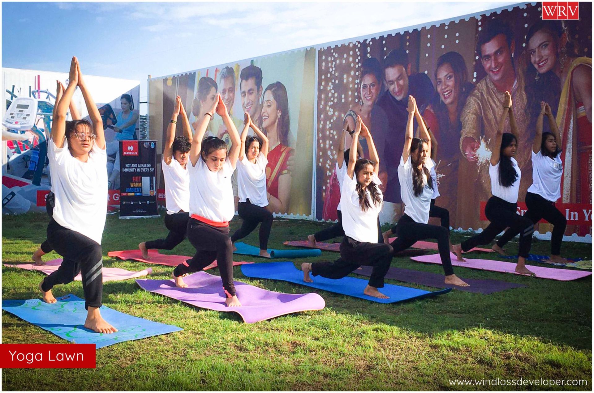 Residents doing yoga together on the yoga lawn at River Valley Township